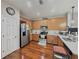 Well-equipped kitchen featuring stainless steel appliances, granite countertops, and ample cabinet space at 6546 Marlberry Way, Largo, FL 33773