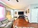 Spacious living room showcasing stylish decor, hardwood floors, and a modern entertainment setup at 6546 Marlberry Way, Largo, FL 33773