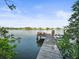 Wooden dock extending to the water with scenic views at 20051 Gulf Blvd, Indian Shores, FL 33785