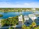 Aerial view of waterfront property with boat slips and nearby amenities at 20051 Gulf Blvd, Indian Shores, FL 33785