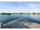 Wooden dock extending over calm water with distant waterfront homes visible at 20051 Gulf Blvd, Indian Shores, FL 33785