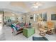 Living room with large mirror, unique sofa, and access to patio at 20051 Gulf Blvd, Indian Shores, FL 33785