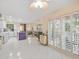 Open concept kitchen with white cabinets, purple island, and living area view at 20051 Gulf Blvd, Indian Shores, FL 33785