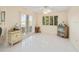 Casual dining area with wood-look floors, sliding glass doors, and built-in cabinetry at 20051 Gulf Blvd, Indian Shores, FL 33785
