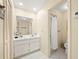 Clean bathroom with single sink vanity, shower, and toilet at 20051 Gulf Blvd, Indian Shores, FL 33785