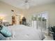 Spacious bedroom with king bed and access to a private balcony at 20051 Gulf Blvd, Indian Shores, FL 33785