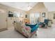 Bright living room with vaulted ceilings, comfortable seating, and access to patio at 20051 Gulf Blvd, Indian Shores, FL 33785