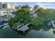 Aerial view of waterfront home with private dock and boat slips at 20051 Gulf Blvd, Indian Shores, FL 33785