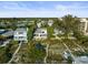 Beachfront property with lush landscaping and several neighboring homes at 20051 Gulf Blvd, Indian Shores, FL 33785
