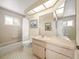 Clean bathroom with updated vanity and tiled floors at 20051 Gulf Blvd, Indian Shores, FL 33785