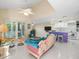 Open living area with high ceilings, comfy furniture, and water views at 20051 Gulf Blvd, Indian Shores, FL 33785