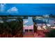 Waterfront home nestled amongst lush greenery, offering privacy and canal access at 20051 Gulf Blvd, Indian Shores, FL 33785