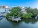 Waterfront property with private dock and lush landscaping at 20051 Gulf Blvd, Indian Shores, FL 33785