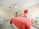 Charming bedroom with coral bedding and coastal decor at 20051 Gulf Blvd, Indian Shores, FL 33785