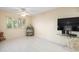 Bright bedroom with wood-look floors, window with shutters, and ceiling fan at 20051 Gulf Blvd, Indian Shores, FL 33785