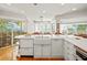 White kitchen with island and ocean views at 20051 Gulf Blvd, Indian Shores, FL 33785