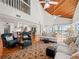 Bright living room with vaulted ceilings, hardwood floors, and ocean views at 20051 Gulf Blvd, Indian Shores, FL 33785
