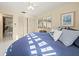 Bright bedroom with a round bed, window seating and lots of natural light at 20051 Gulf Blvd, Indian Shores, FL 33785