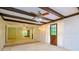 Open living area with wood beams and doors at 15350 Scanio Dr, Spring Hill, FL 34610