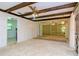 Spacious living room with wood beams and carpet at 15350 Scanio Dr, Spring Hill, FL 34610