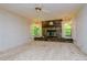 Living room with a stone fireplace and large windows at 15350 Scanio Dr, Spring Hill, FL 34610
