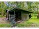 Rustic barn with gated stalls and fenced area at 15350 Scanio Dr, Spring Hill, FL 34610