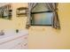 Small bathroom with single vanity and window at 15350 Scanio Dr, Spring Hill, FL 34610