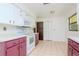 White and mauve kitchen with ample counter space and built-in appliances at 15350 Scanio Dr, Spring Hill, FL 34610