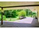 View from the deck showcasing a large backyard with lush greenery at 15350 Scanio Dr, Spring Hill, FL 34610