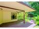 Covered back porch with a view of the gazebo and garden at 15350 Scanio Dr, Spring Hill, FL 34610