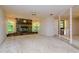 Spacious living room featuring a stone fireplace and high ceilings at 15350 Scanio Dr, Spring Hill, FL 34610