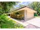 House exterior showcasing stone facade and attached garage at 15350 Scanio Dr, Spring Hill, FL 34610