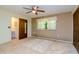 Bright bedroom with ensuite bathroom and ceiling fan at 15350 Scanio Dr, Spring Hill, FL 34610
