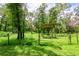 Open pasture area with a gate and a shelter at 15350 Scanio Dr, Spring Hill, FL 34610