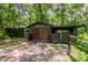 Exterior view of barn with double doors and tack room at 15350 Scanio Dr, Spring Hill, FL 34610