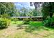 Ranch style home with landscaping and a large yard at 15350 Scanio Dr, Spring Hill, FL 34610