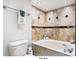 Bathroom with soaking tub and tile accents at 1310 Gulf Blvd # 18C, Clearwater Beach, FL 33767