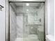 Beautiful bathroom featuring a shower with glass doors and modern, gray-veined tile at 1433 S Belcher Rd # G10, Clearwater, FL 33764