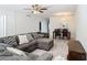 Comfortable living room featuring a large sectional sofa, wood-look flooring, and a dining area for entertaining at 1433 S Belcher Rd # G10, Clearwater, FL 33764