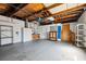 Spacious unfinished basement offers ample storage and potential for customization with exposed rafters at 1549 Linwood Dr, Clearwater, FL 33755