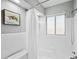 Clean bathroom with white tiled walls and bathtub shower combo at 1549 Linwood Dr, Clearwater, FL 33755