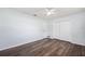 Bedroom featuring wood floors, closet doors, and a ceiling fan at 1549 Linwood Dr, Clearwater, FL 33755