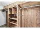 Wooden closet with shelving and a clothing rod at 1549 Linwood Dr, Clearwater, FL 33755