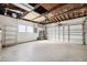 Spacious garage with overhead door and ample storage shelving at 1549 Linwood Dr, Clearwater, FL 33755