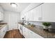 Bright kitchen features white cabinets, granite countertops, and modern appliances at 1549 Linwood Dr, Clearwater, FL 33755