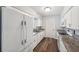 Bright kitchen features white cabinets, granite countertops, and modern appliances at 1549 Linwood Dr, Clearwater, FL 33755