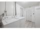 Functional laundry room equipped with a washer, dryer, and storage cabinets at 1549 Linwood Dr, Clearwater, FL 33755