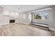 Spacious living room with fireplace and wood-look floors at 1549 Linwood Dr, Clearwater, FL 33755