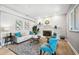Comfortable living room with a fireplace, soft seating, and stylish decor at 1549 Linwood Dr, Clearwater, FL 33755