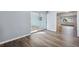 Spacious room with hardwood floors and slider to exterior at 1549 Linwood Dr, Clearwater, FL 33755